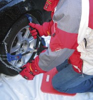 Mounting snow chains.
